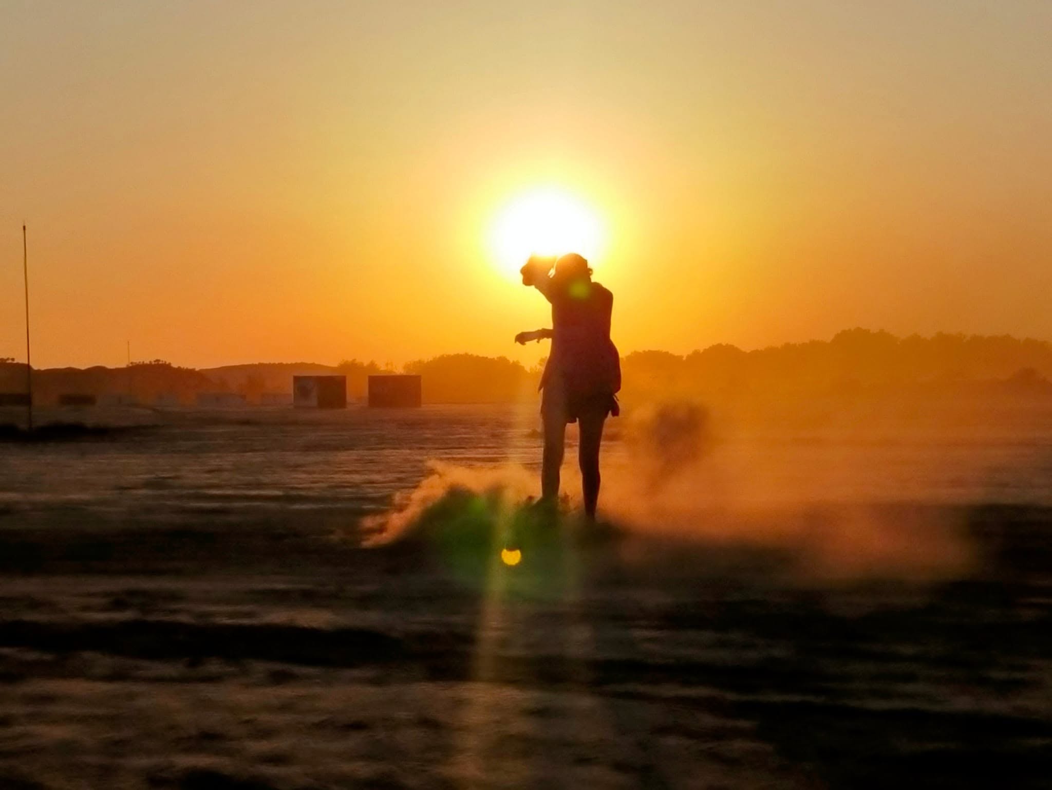 Photographer working at sunset, photographed by Angie LC
